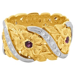 Platinum 
14 Karat Rose Gold Ruby and Diamond Flower Band