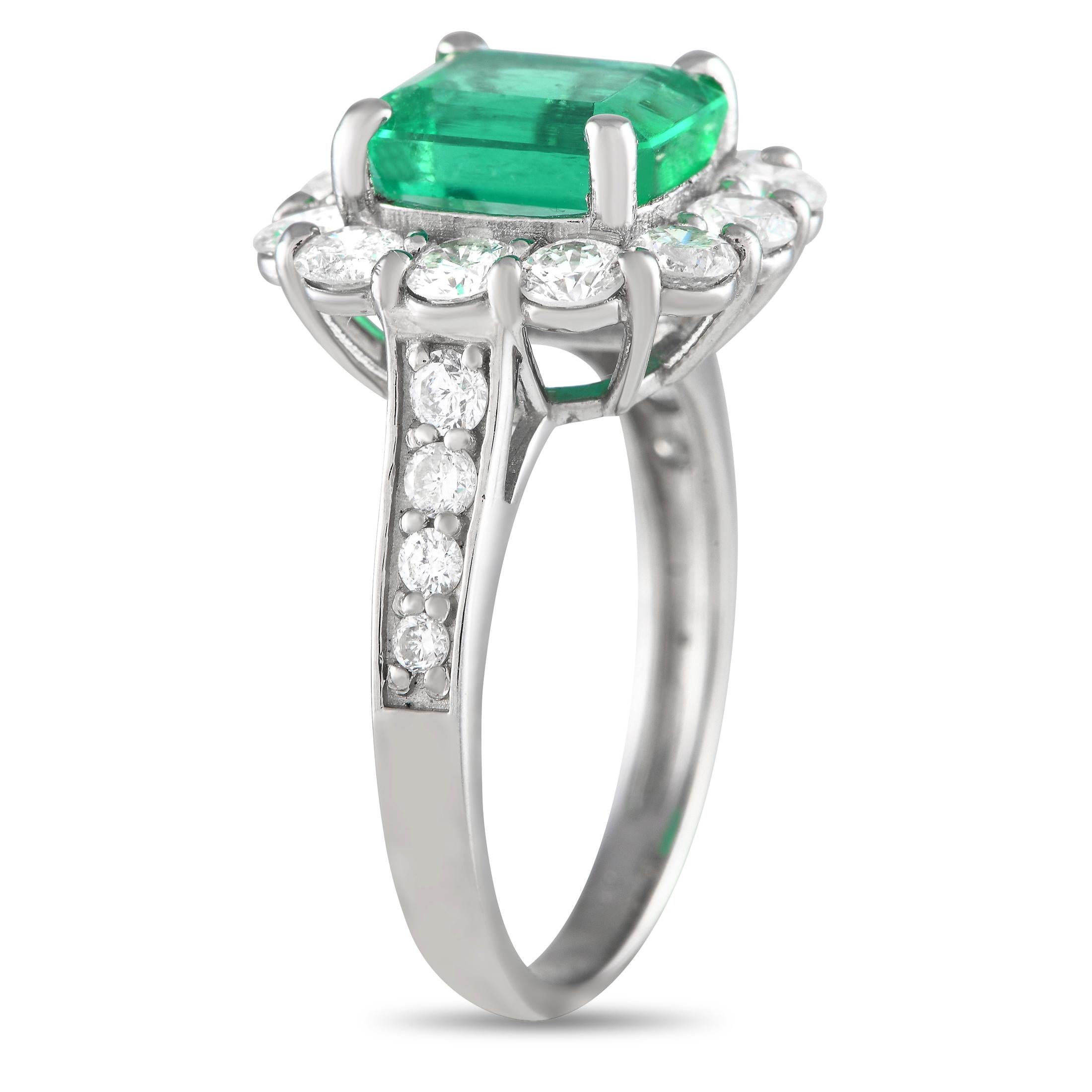 Expect to find yourself marveling at the beauty of this ring. An piece, this sparkler is luxuriously crafted in 950 platinum and decorated with a halo of round diamonds surrounding a gorgeous 2.44-carat emerald gemstone. Round diamonds that taper in