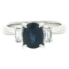 Platinum 1.47ctw Oval Royal Blue Sapphire Baguette Diamond Accents Sides Ring