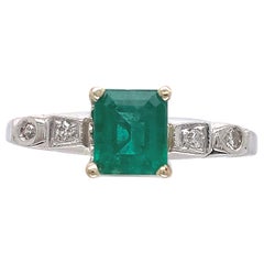 Bague en platine + 14K .82ct émeraude et diamant
