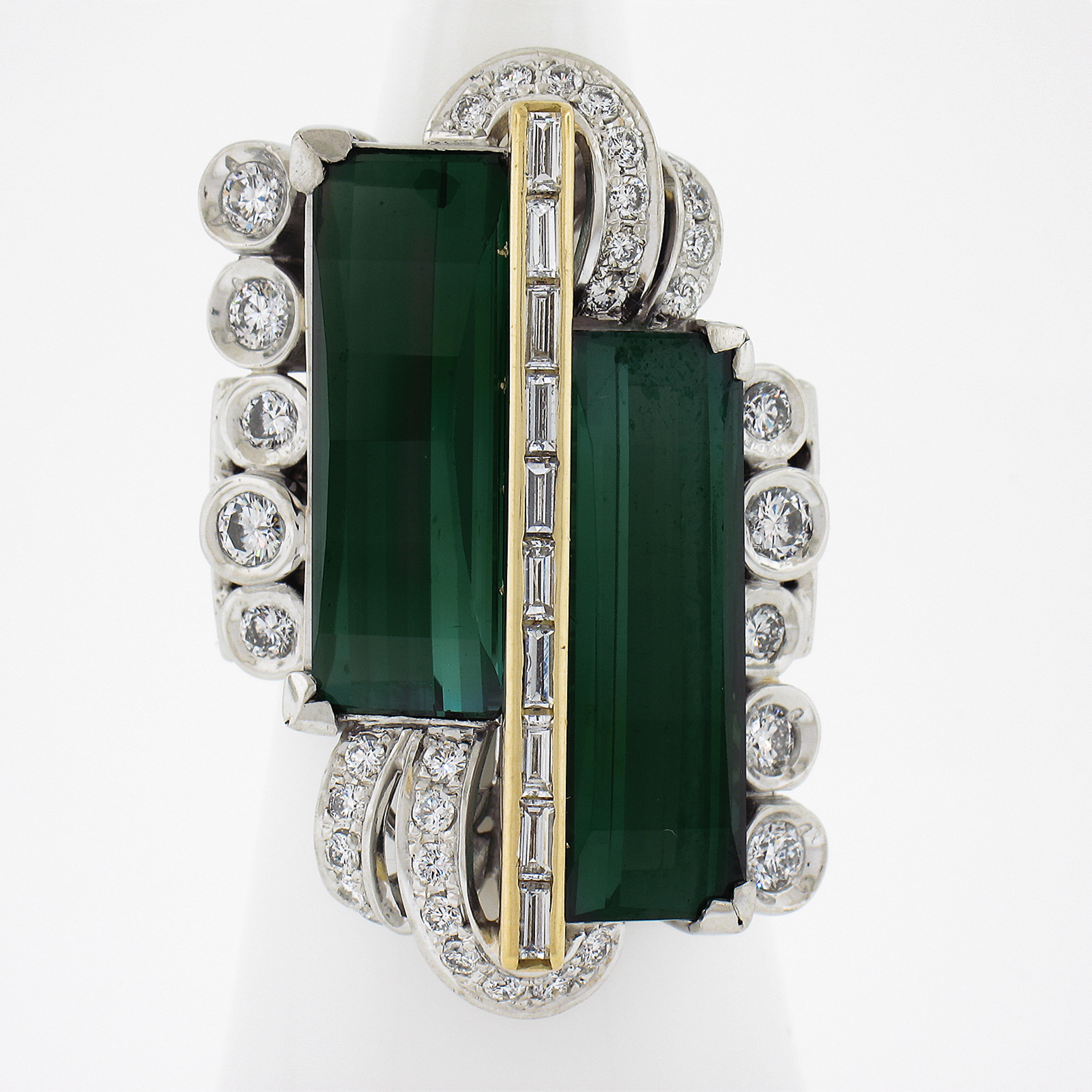 --Stone(s):--
(2) Natural Genuine Tourmalines - Long Emerald Cut - Prong Set - Amazing Green Color - 8.17 & 8.11ctw (approx.)
(46) Natural Genuine Diamonds - 36 Round Brilliant & 10 Baguette Cut - Channel, Pave & Bezel Set - F-H Color - VS1/VS2