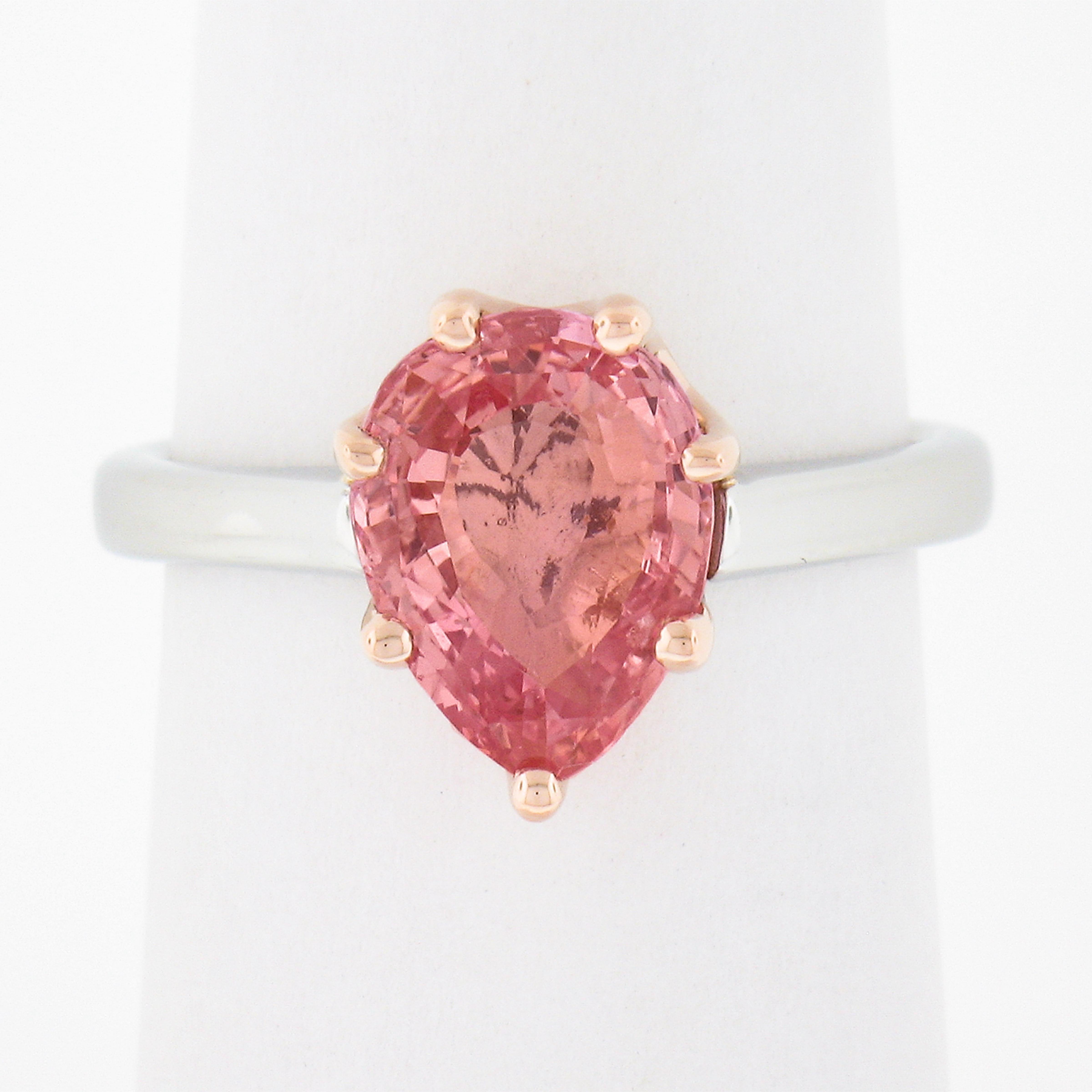 Here we have a gorgeous sapphire solitaire engagement ring that was newly crafted from solid platinum shank & 14k rose gold scalloped basket. The center stone is a pear brilliant cut 2.51 carat GIA certified MAGNIFICENT Padparadscha orange-pink