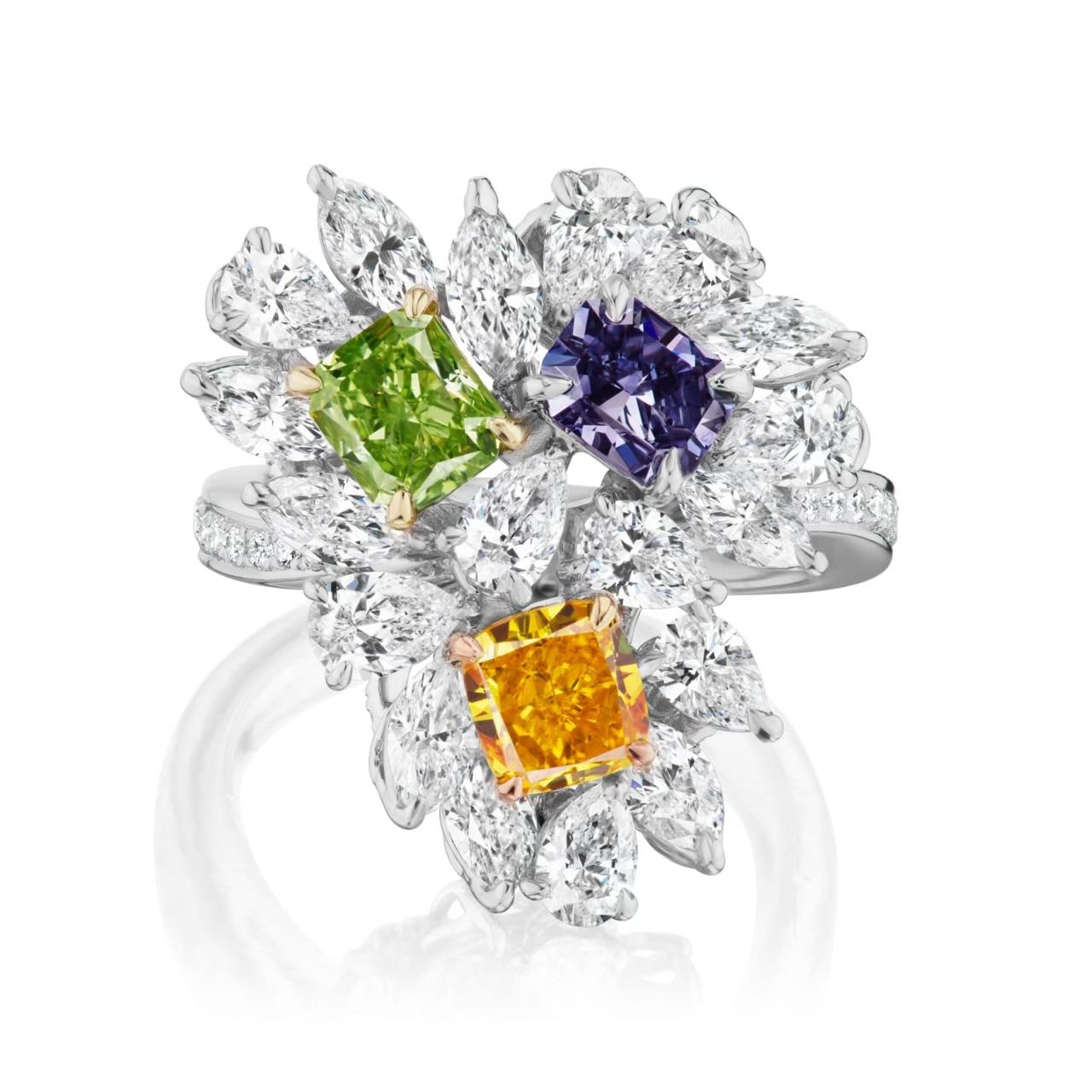 We are pleased to offer this Rare Ladies Platinum & 14k Gold GIA Certified Fancy Colored Orange, Blue & Green Diamond 3 Stone Ring. This stunning ring features 4.43ctw natural fancy, fancy vivid and white colored diamonds. The three beautiful and