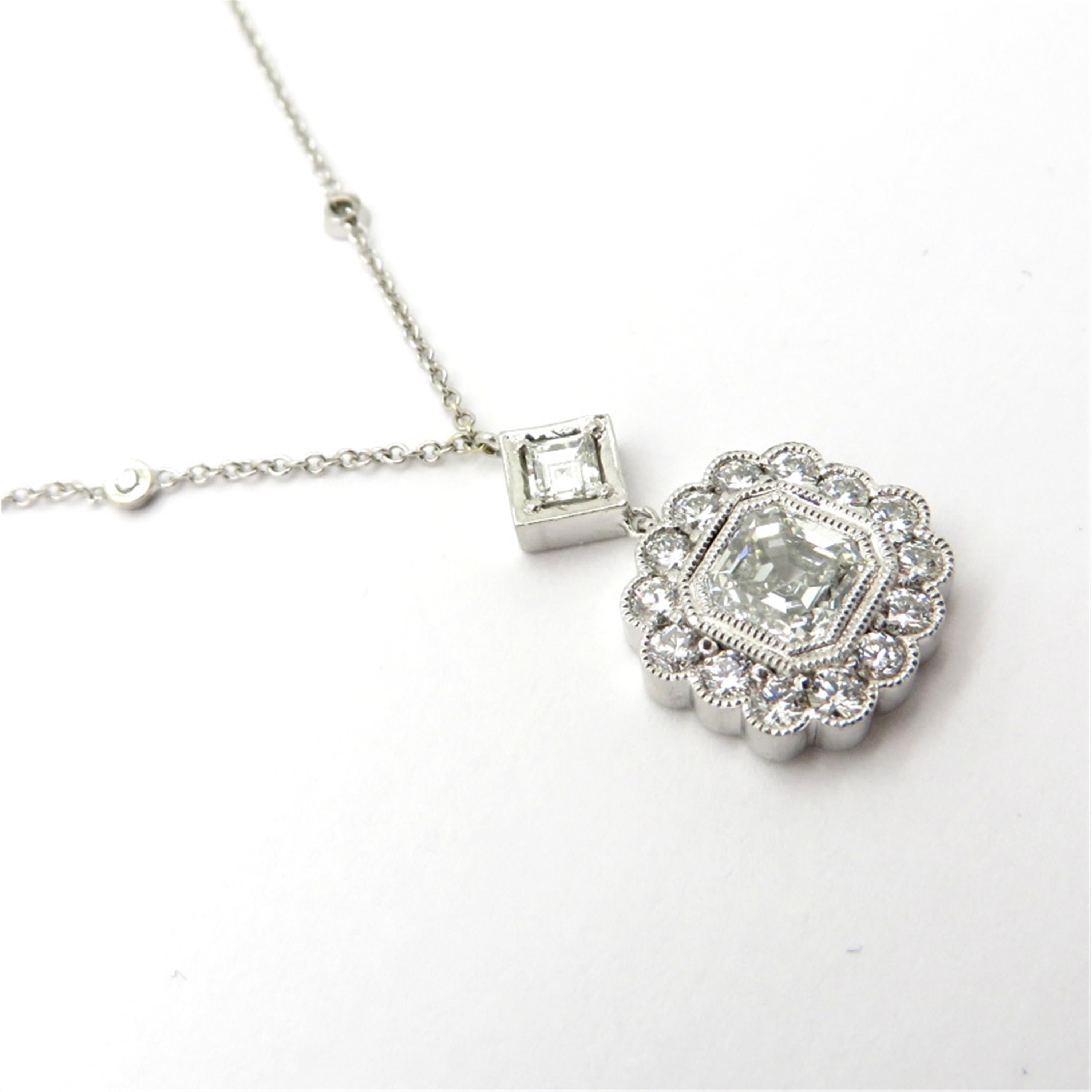 Platinum and 14K white gold GIA certified asscher and round diamond bezel set necklace. Centering one asscher cut GIA certified diamond weighing approximately 1.00 carat. Diamond grading: color grade: G. Clarity grade: VS2. Displaying one Asscher