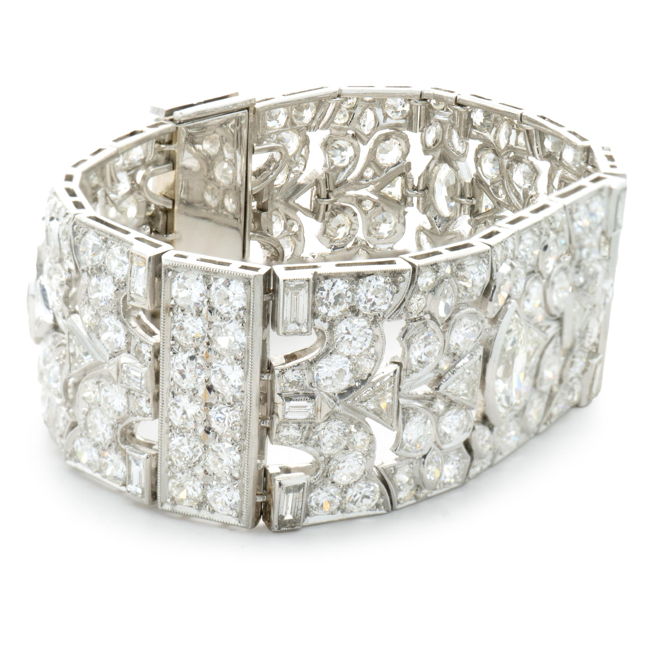 Designer: custom design
Material: Platinum & 14K white gold
Diamond: 2 marquise cut = 0.90cttw
Color: J
Clarity: VS2
Diamond: 375 round, baguette, marquise & trillion cut = 18.00cttw
Color: H / I / J
Clarity: SI1-2
Dimensions: bracelet will fit up