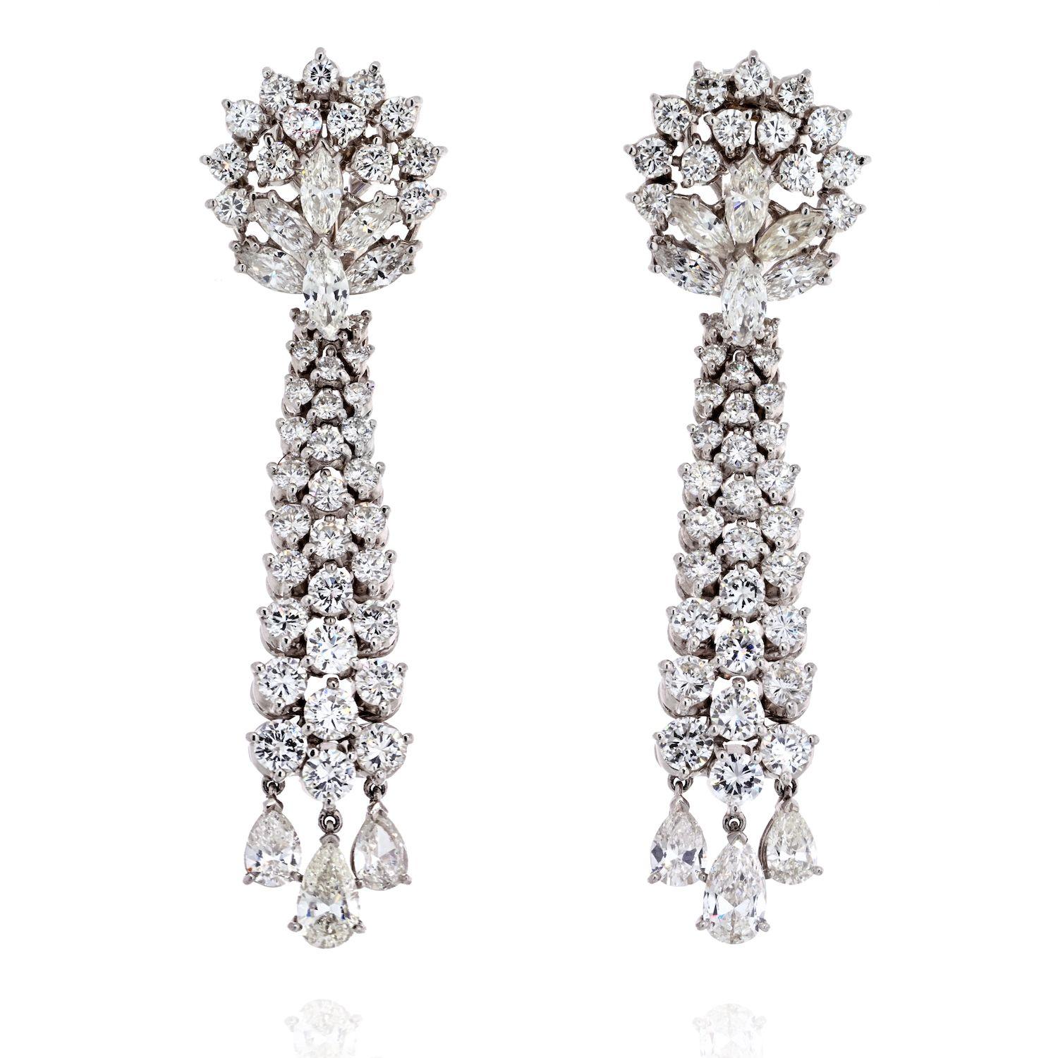 Light up every look with our estate fine diamond chandelier earrings. Inspired by the glitz and glam of Hollywood cinema sirens. Rows of falling diamonds create a radiant sparkle. These lovely diamond drop earrings are set with full cut round, pear