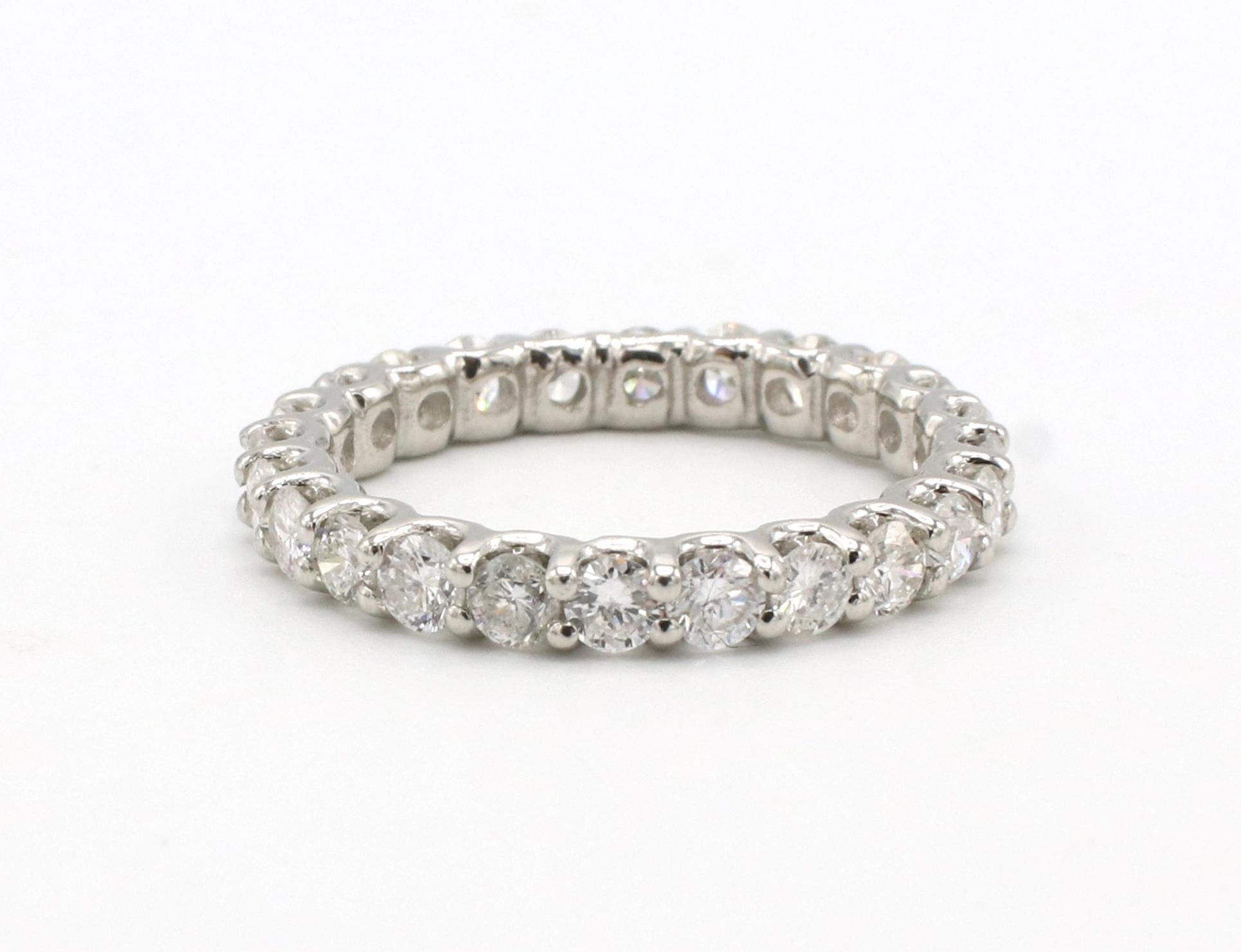 Platinum 1.50 Carat Natural Round Diamond Eternity Band Ring 
Metal: Platinum
Weight: 4.18 grams
Diamonds: Approx. 1.50 carats natural round diamonds G-H SI
Size: 6 (US)
Width: 2.6mm
