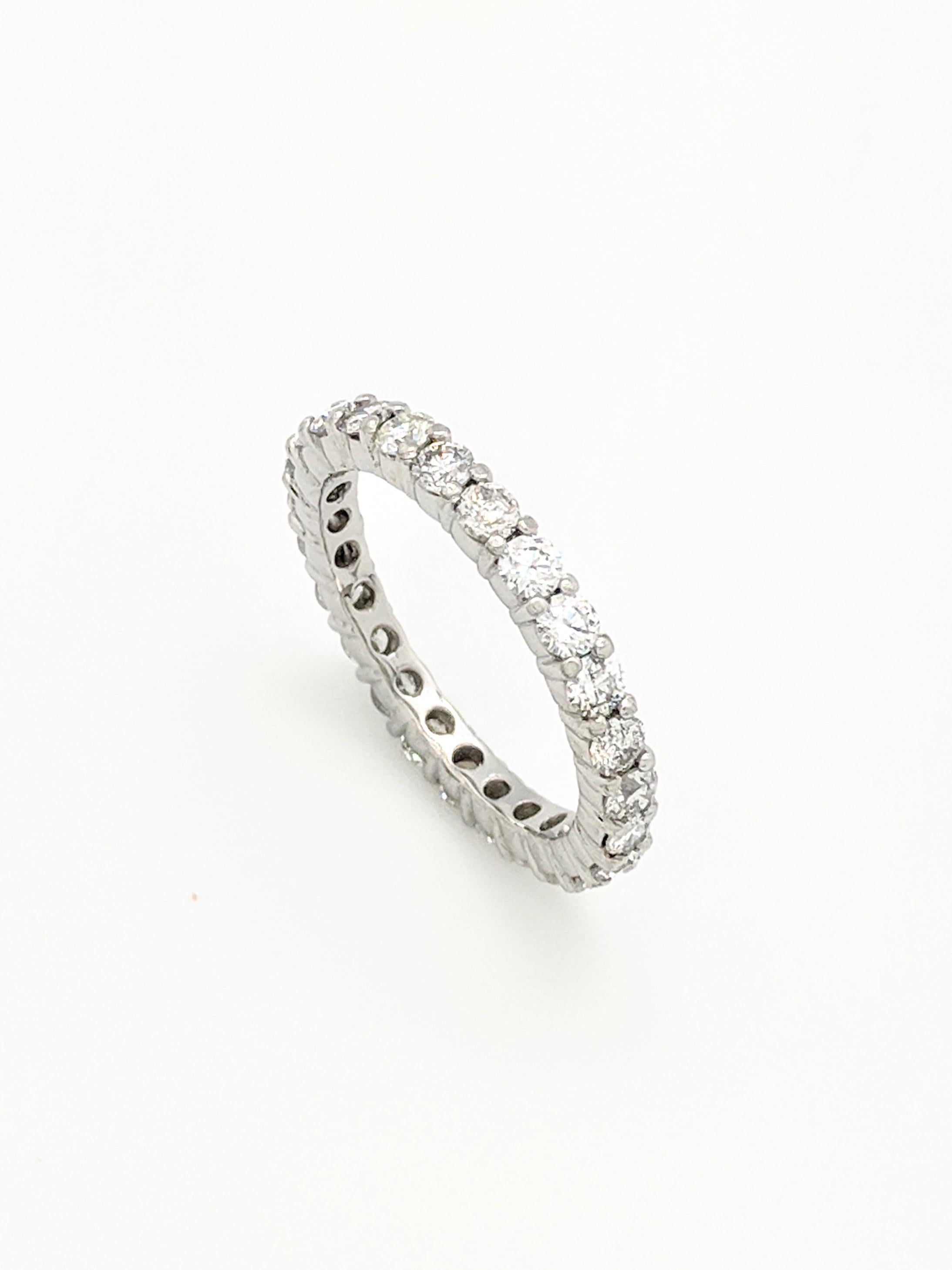 You are viewing a Stunning Diamond Eternity Band. This ring is crafted from platinum and features (25) natural round diamonds for an estimated 1.50ctw. We estimate the diamonds to be SI1 in clarity and G in color. This ring weighs 4.5 grams, is