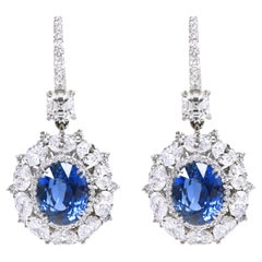 Platinum 15.23 Carats Solitaire Diamond and Blue Sapphire Cocktail Earrings