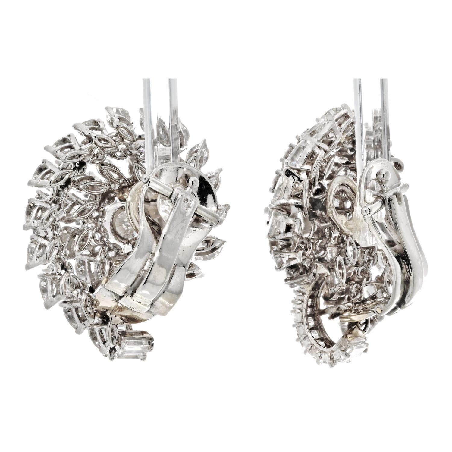 These gorgeous, glamorous and sexy earclips, each of radiating scroll design are made with Round cut Diamonds in the centre and Marquise shaped Diamonds along with small round cut diamonds in between. Altogether weighing 16.00cttw. 
Mounted in