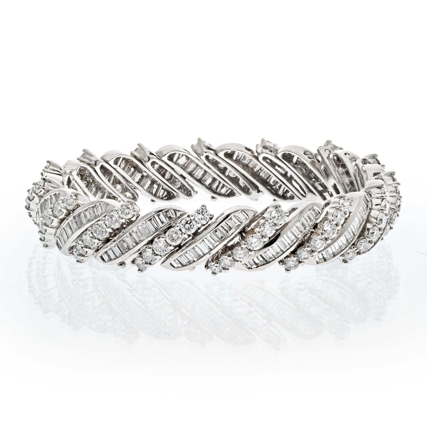 This platinum midcentury round and baguette cut diamond bracelet is a truly unique and exquisite piece of jewelry. The combination of round and baguette cut diamonds creates a mesmerizing sparkle and shine that is truly remarkable. This bracelet is