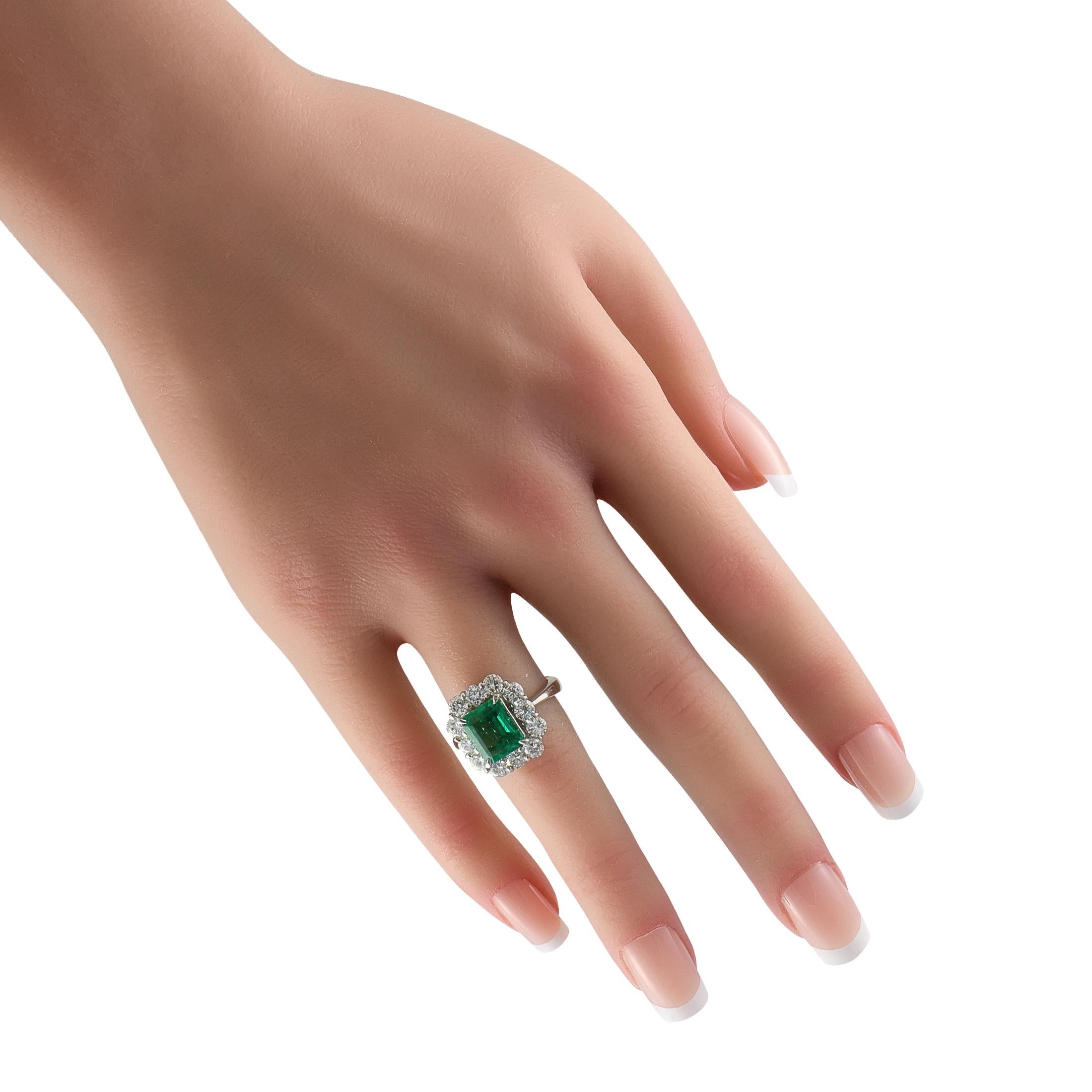 Round Cut Platinum 1.67ct Diamond and Emerald Ring
