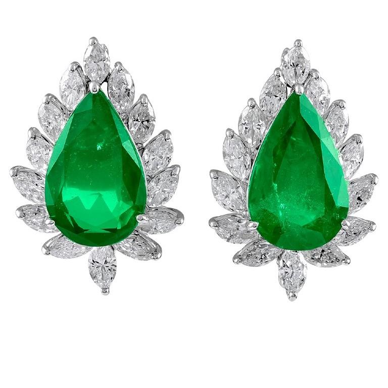 Exquisite designed platinum pear shaped emeralds with the total weight of 12.17 carats surrounded by gorgeous diamonds with weighing 17.12 carat earrings


