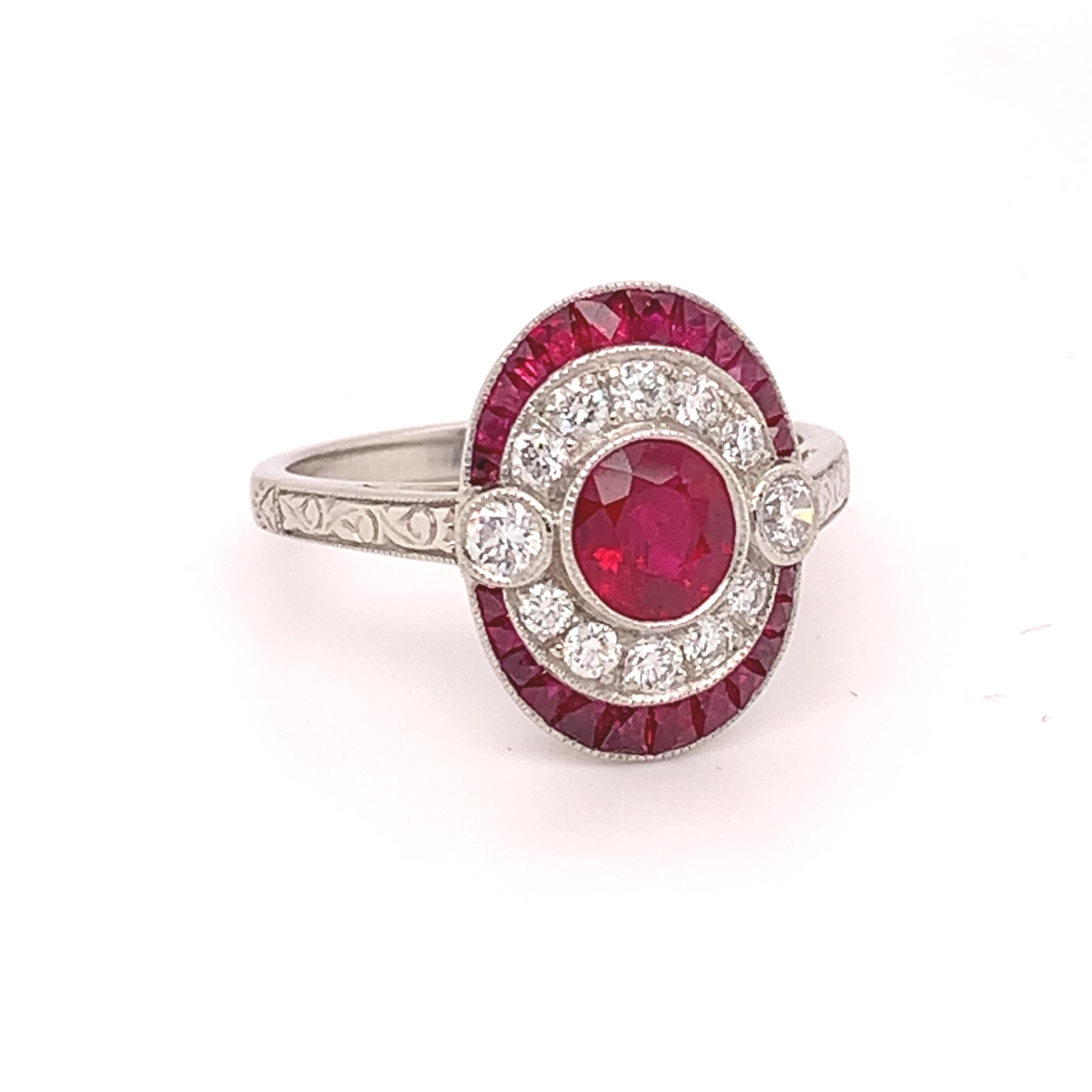 Platinum 1.78ct Genuine Natural Ruby and Diamond Ring (#J4860)

Platinum ruby and diamond ring with specialty cut rubies; over 1 3/4 cts total weight of genuine red earth mined rubies. The center round ruby measures about 5mm and weighs .74cts. The