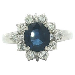 Platinum 1.7ctw Oval Deep Vibrant Blue Sapphire w/ Diamond Cluster Flower Ring