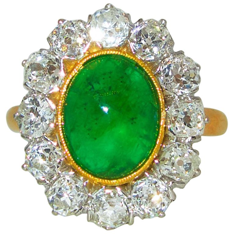 Platinum, 18 Karat, Emerald and Diamond Ring