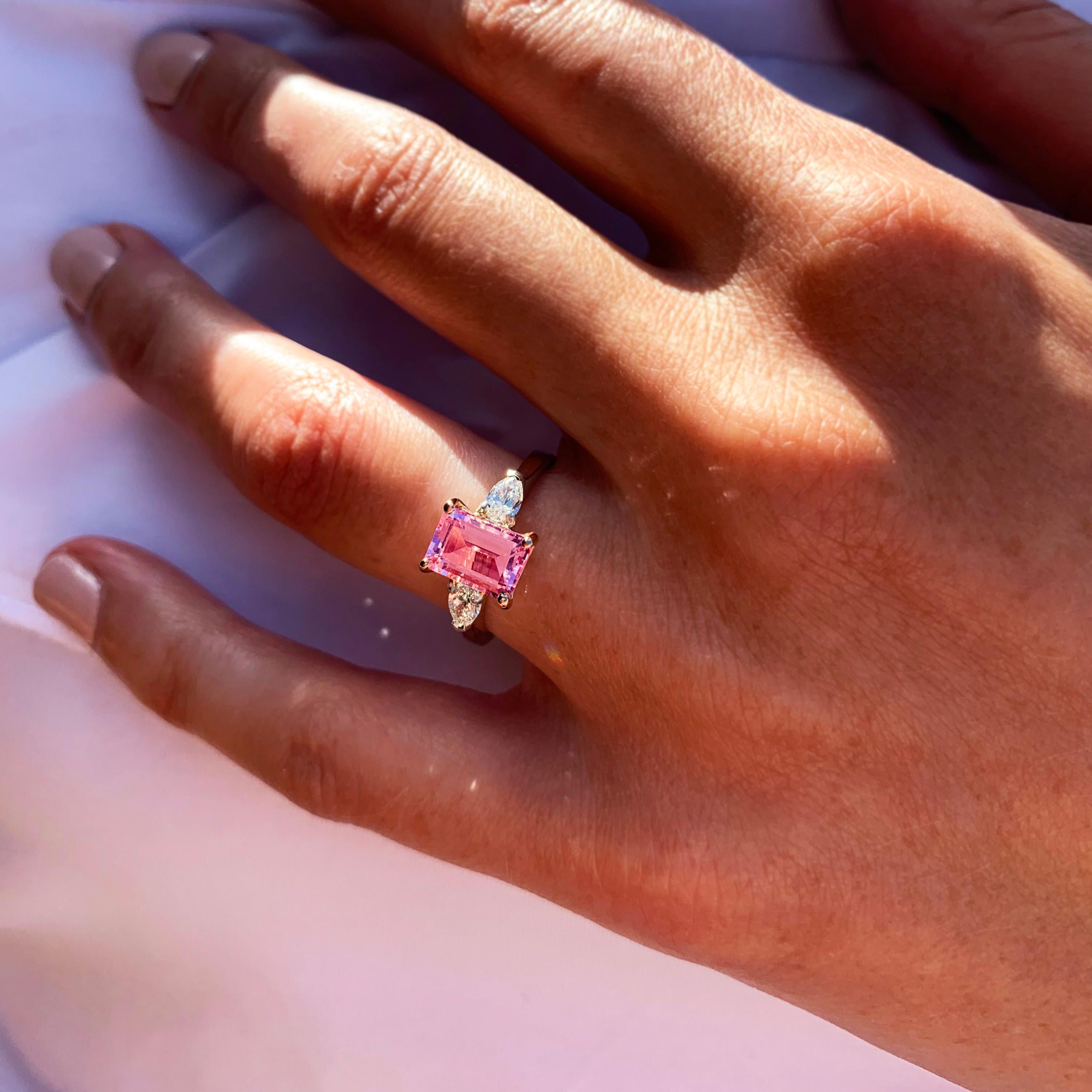 Contrasting shapes make this beautifully crafted Brazilian pink tourmaline (1.80ct) and pear diamond (0.37ct E VS1) ring a real beauty, Vibrant pink married with the most exceptional pear diamonds and gleaming platinum make this a piece to