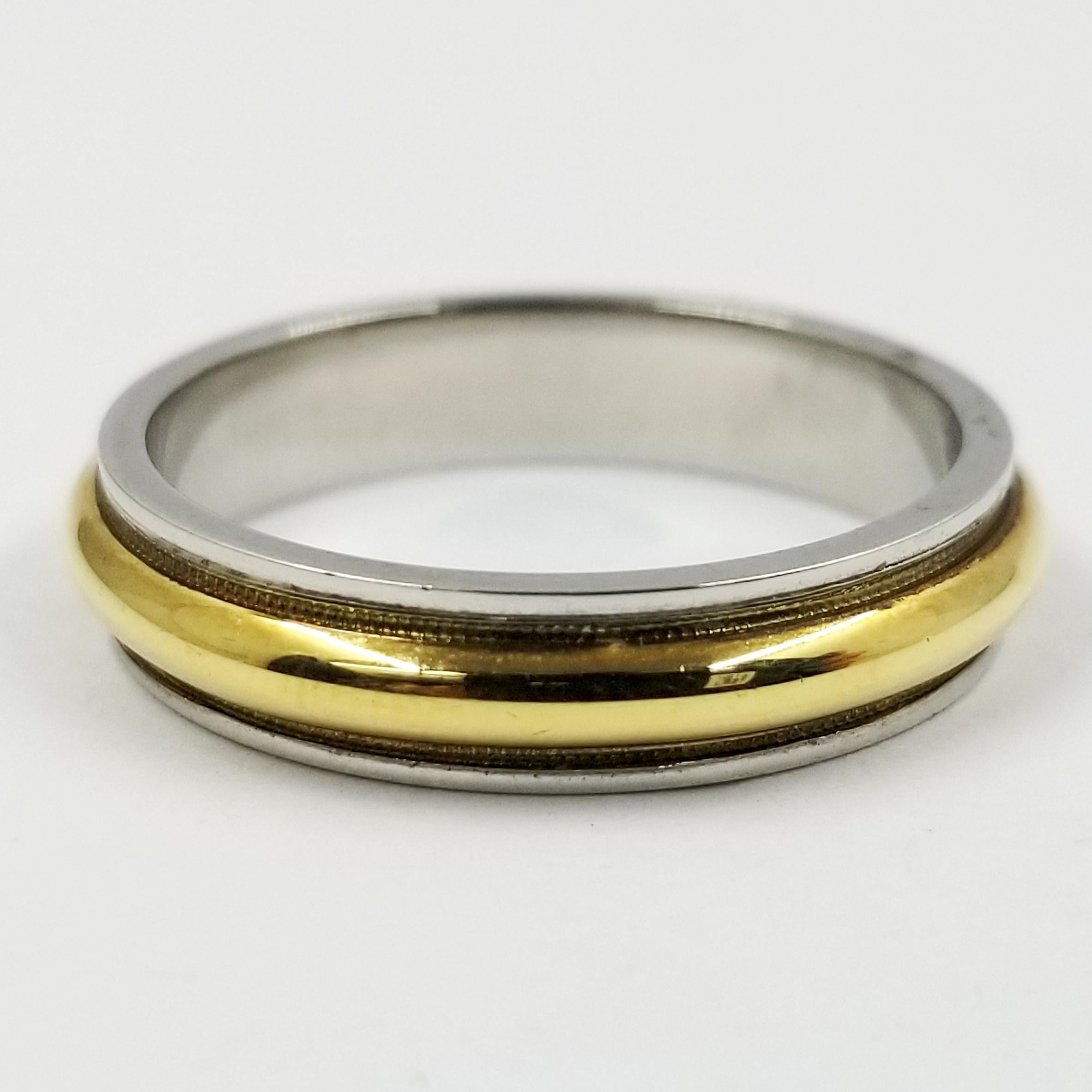 Platinum & 18 Karat Yellow Gold High Polish Wedding Band. 5mm Wide With Domed Center With Milgrain Edge. Finger Size 10
