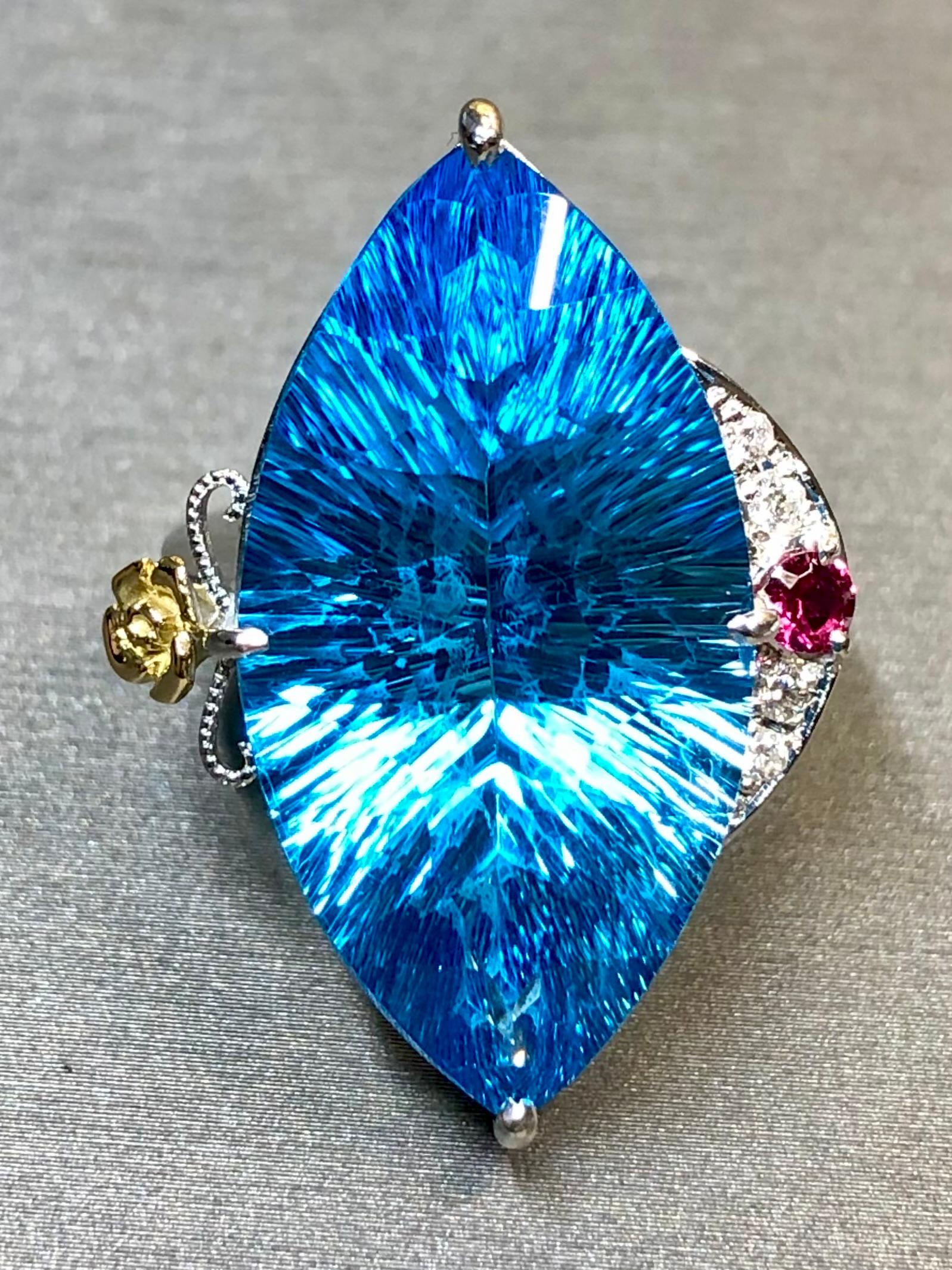 
Not all topaz rings are created equal and we try to stock only pieces that are not just well done but unusual and a bit harder to find… and this ring is no exception. Crafted in platinum with 18K yellow gold accents, it has been centered by a