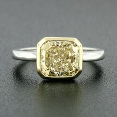 Platinum & 18k Gold 2.55 Carat GIA Fancy Yellow Diamond Solitaire Bezel Set Ring