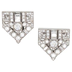 Broche con doble clip de diamantes en oro de 18 quilates y platino