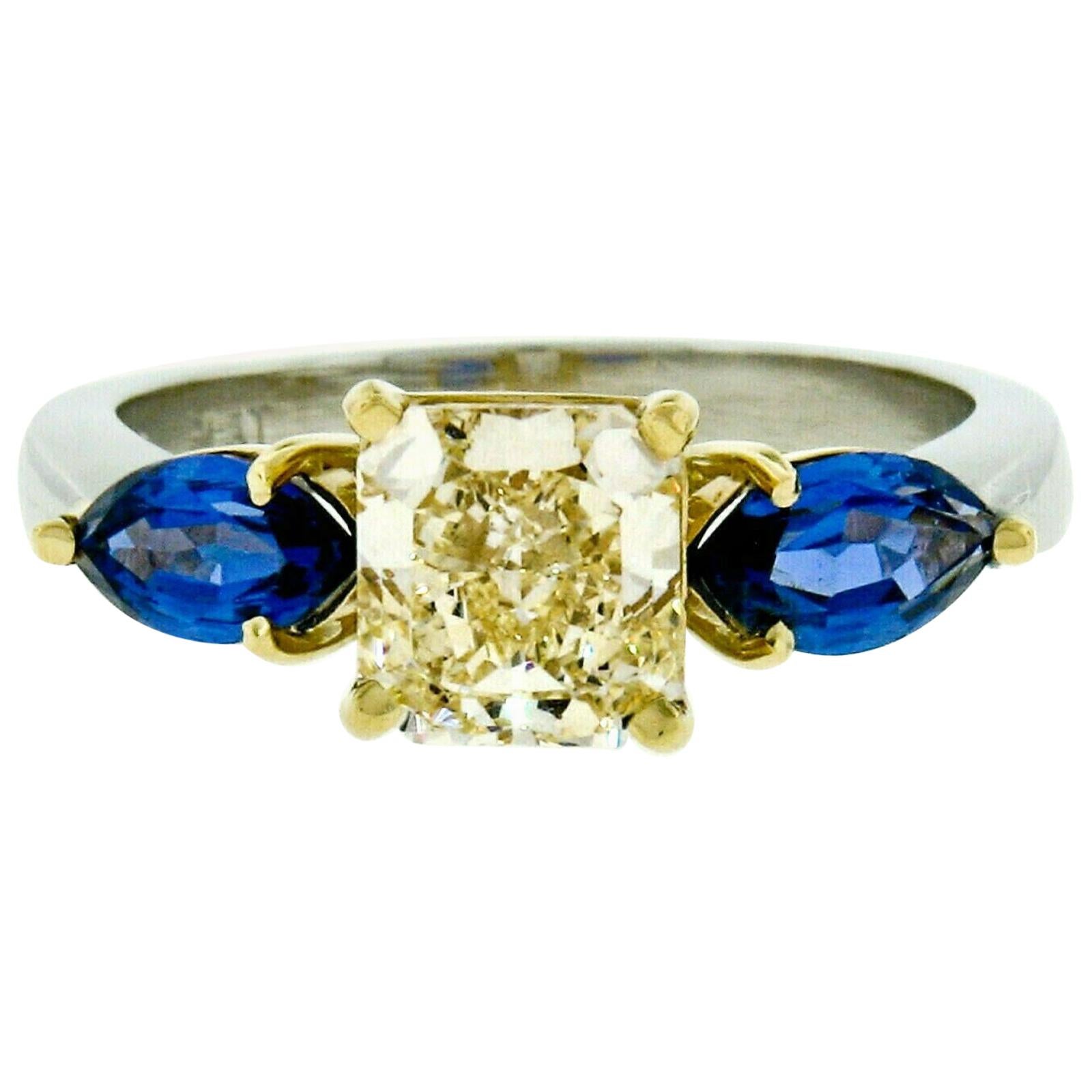 Bague en platine 18k ornée d'un diamant jaune radiant fantaisie et d'un saphir marquise de 1,46 carat certifié GIA