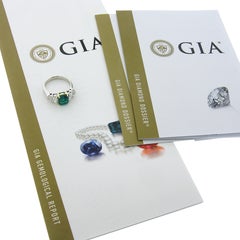 Bague de fiançailles en platine et or 18 carats avec émeraude de Colombie et diamant trapézoïde certifié GIA