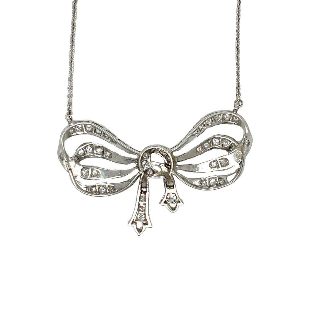 Art Deco Platinum/ 18K White Gold Antique Cut Diamond Bow Ribbon Necklace Pendant For Sale
