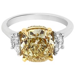 Platinum and 18 Karat White Gold Cushion Cut Half Moon Light Yellow Diamond Ring
