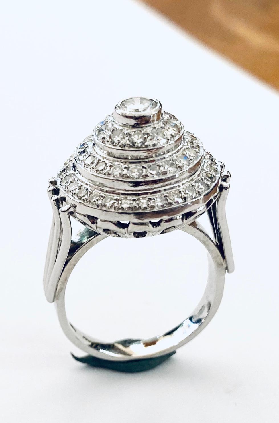 - One (1) 18K. white gold and platinum ring, three double entourage model: called: 