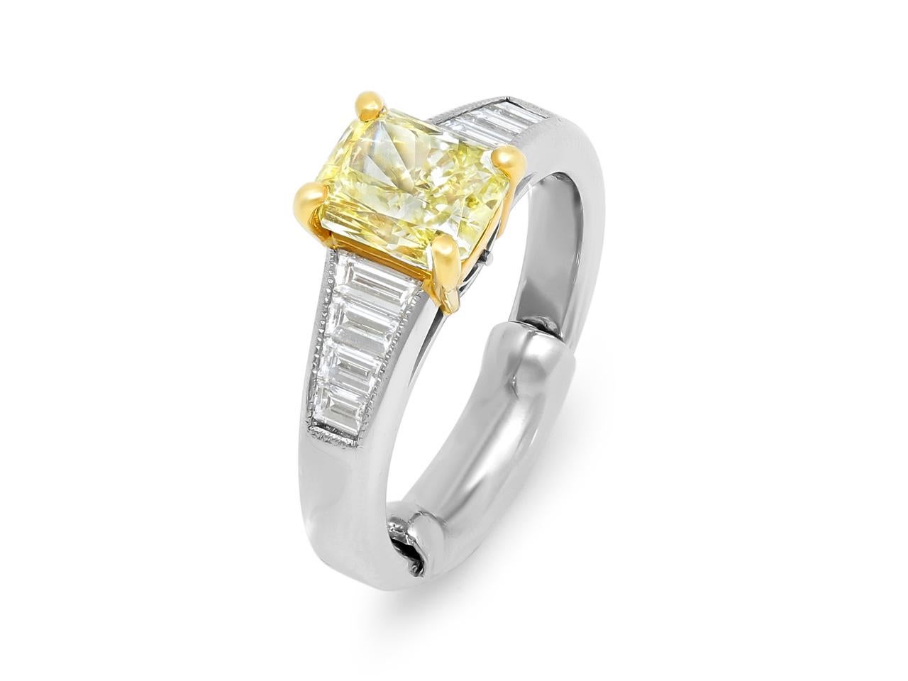 Featuring a 1.68ct Fancy Intense Yellow radiant cut diamond (VS1 clarity), certified by GIA #6193719553, set in 18K yellow gold. The platinum band is accented with eight tapered baguette diamonds (~0.50ct total), creating a timeless and elegant