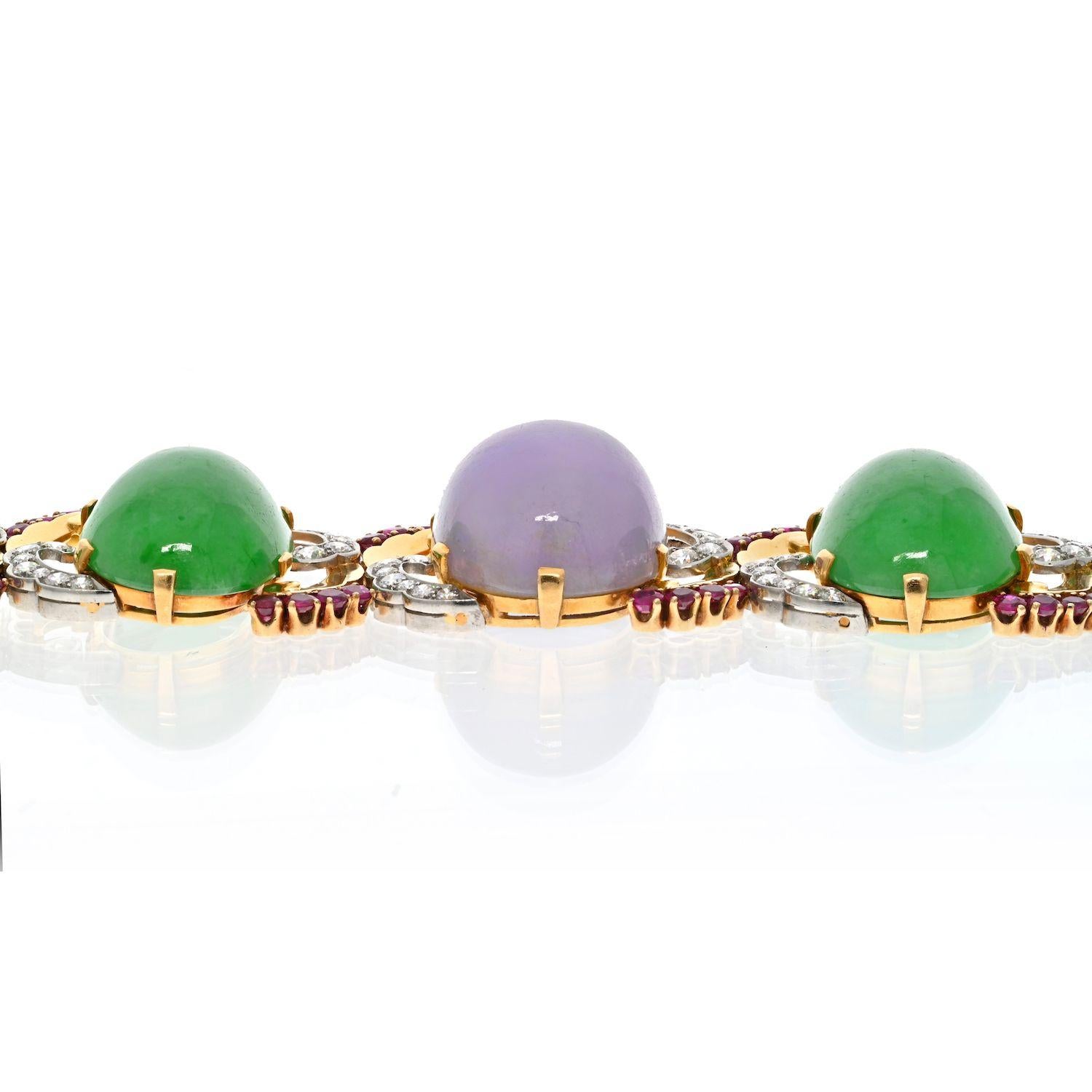 This is a breautiful 1940's yellow gold and platinum bracelet mounted with cabochon oval cut Jade, diamonds and rubies. We are absolutely in love with this vintage gem! The incredible rich colors, fine detailing and Old World charm make this