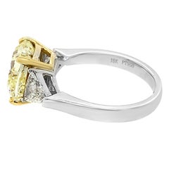 Platinum and 18 Karat Yellow Gold Cushion Cut Natural Fancy Yellow Diamond Ring