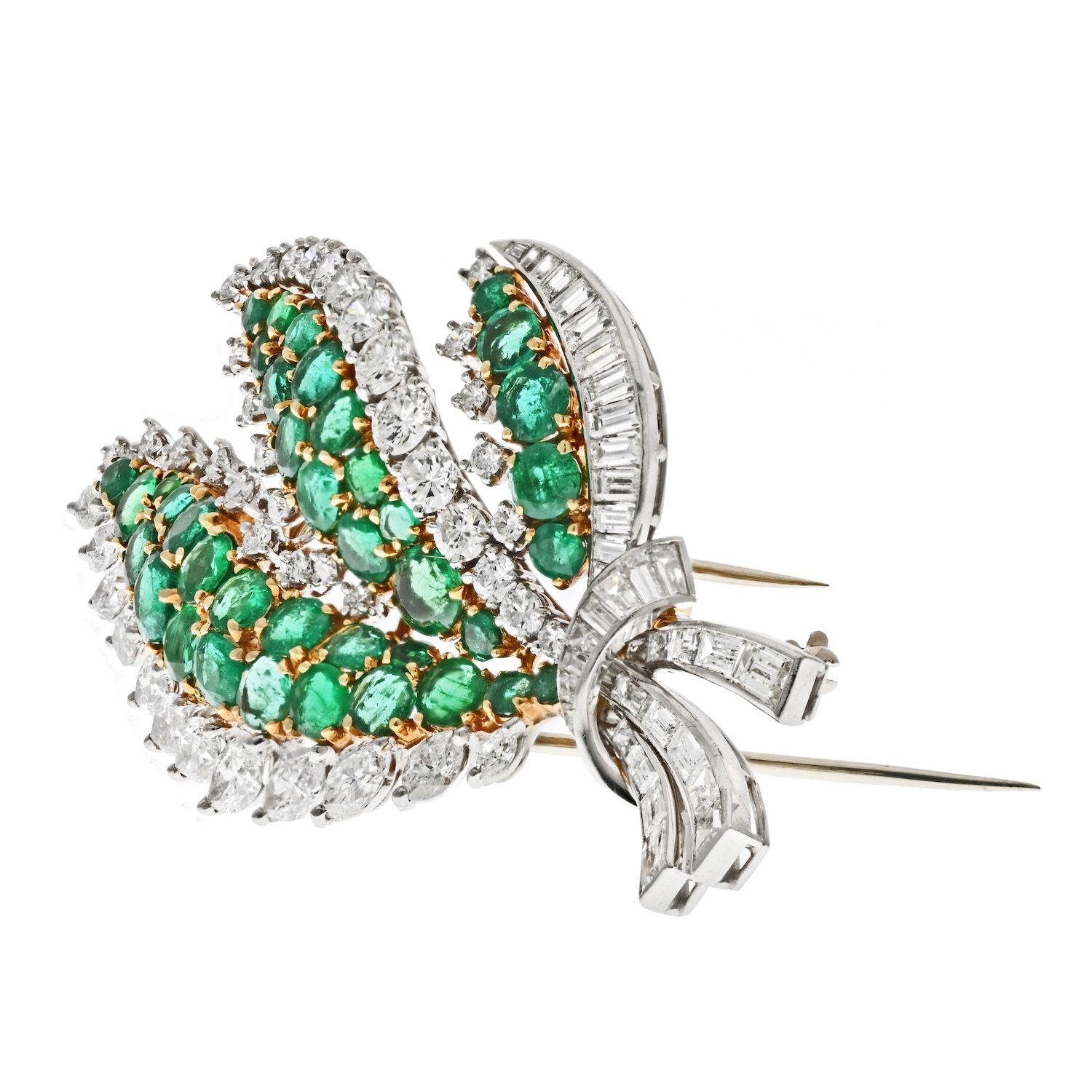 This Platinum & 18K Yellow Gold Diamond and Green Emerald Leaf Brooch is a beautiful and unique piece of jewelry that makes a lovely gift. It features a beautiful leaf design, crafted with 18K yellow gold and studded with various shape diamonds and
