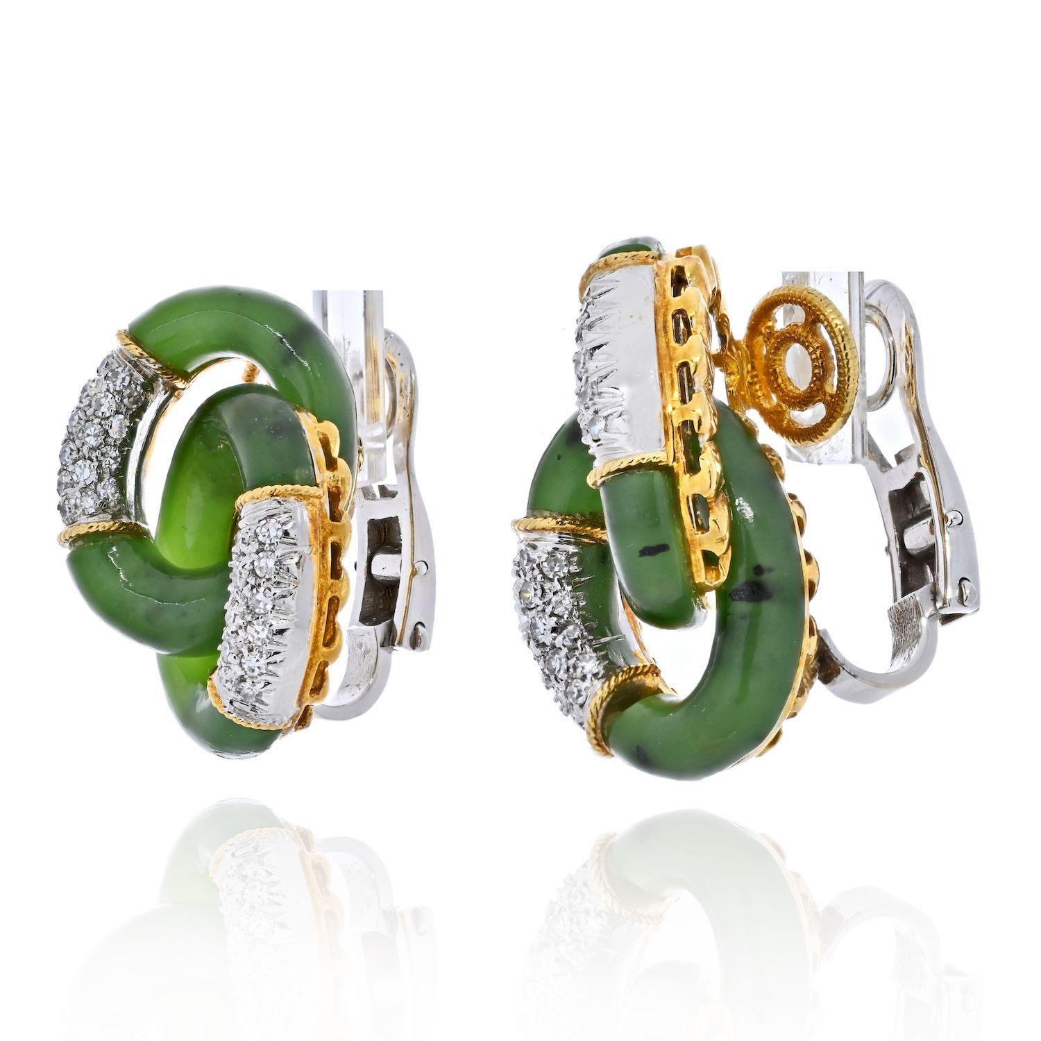 Simple in design yet timeless these vintage interlocking hoop earrings are crafted in 18k yellow gold, with diamonds upon platinum. 
Jade is of natural green color, very earthy feel. 
These earrings are about 1 inch long. 
We can see today's modern