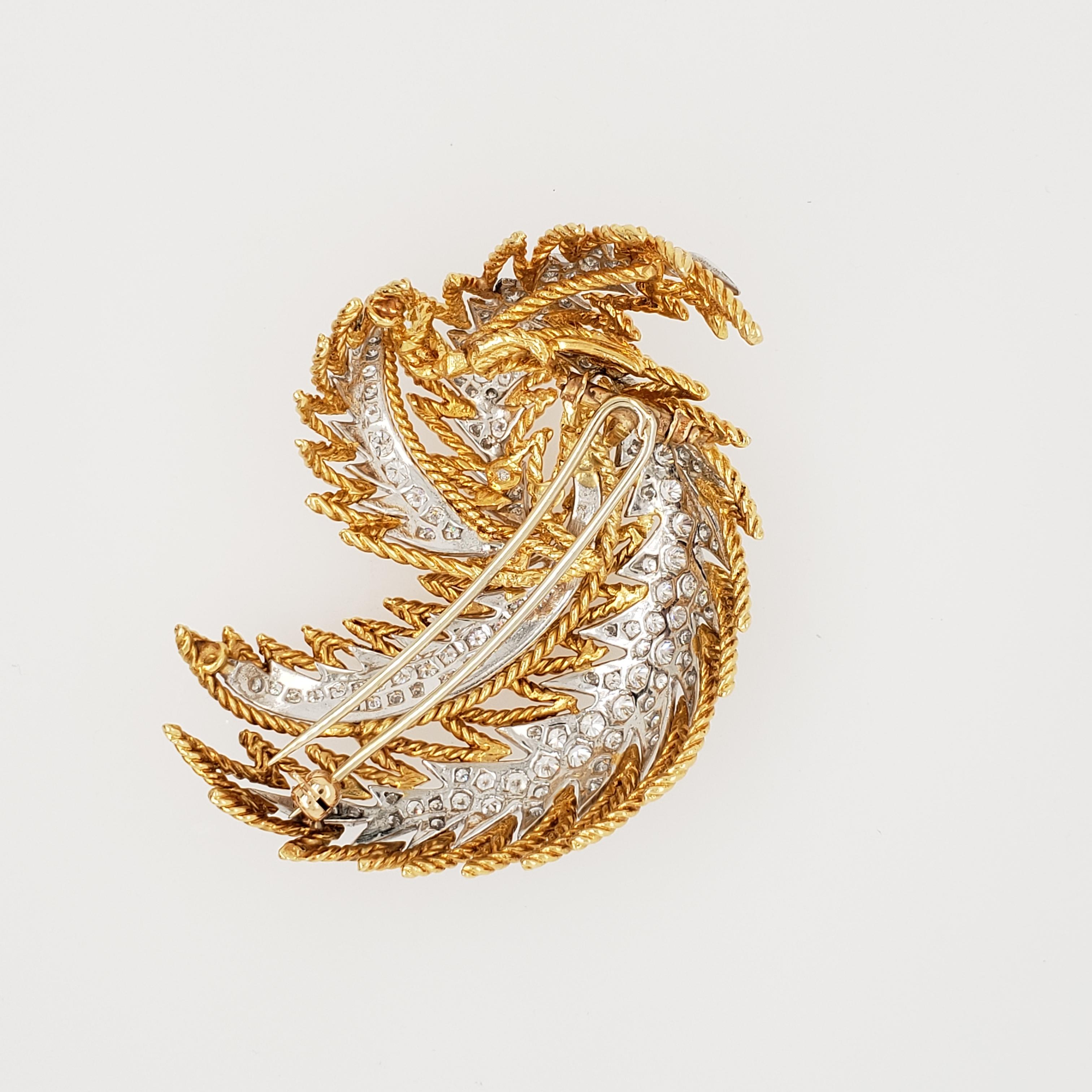 18kt Yellow Gold & Platinum Diamond Feather Brooch.  The diamonds have a total carat weight of aprx. 3.5 ct. A beautiful brooch with stunning delicate design. 
