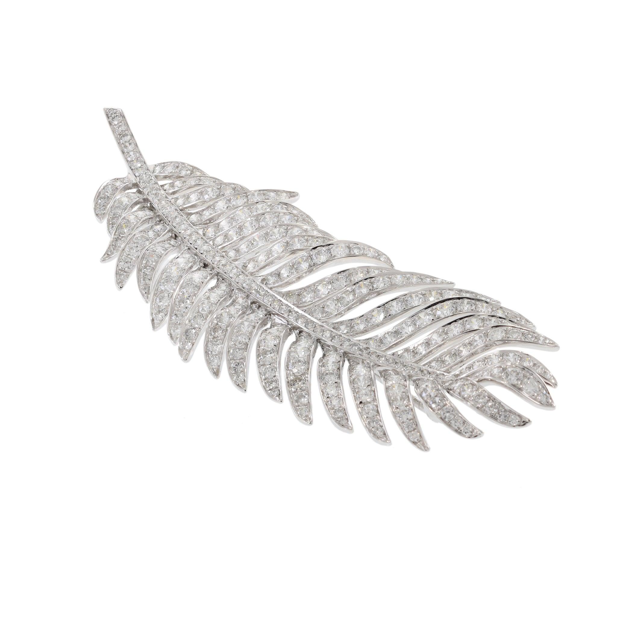 Platinum/18KT Yellow Gold Palm Leaf Diamond Brooch. This exquisite brooch features a stunning palm leaf design set with 6.32 carats total weight of G-VS round cut diamonds. Weighing 17.36 grams, the luxurious combination of platinum and 18KT yellow