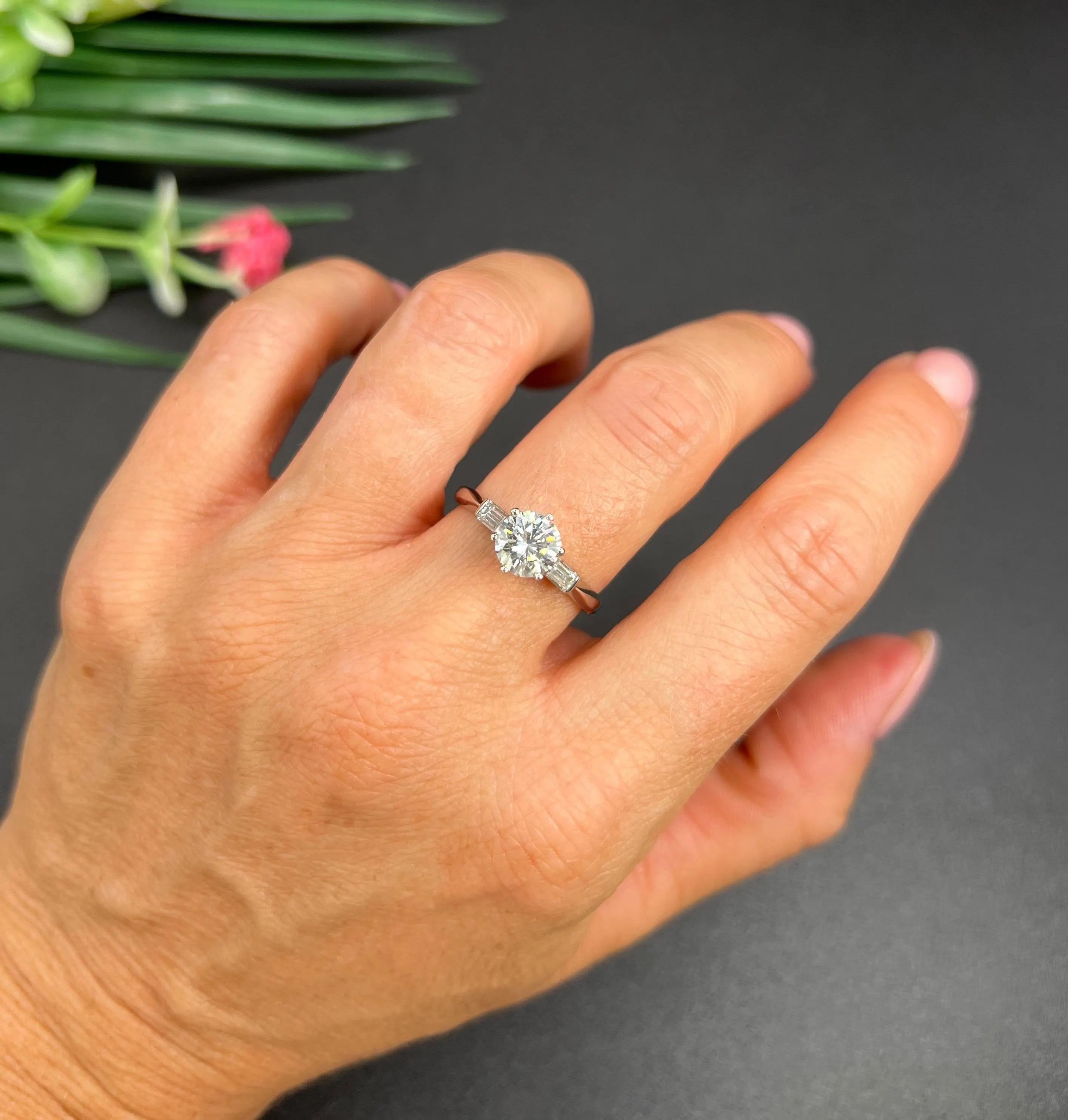 Diamond Ring

Platinum Hallmarked

Circa 1920s 

This exquisite engagement ring showcases a dazzling display of antique charm and modern craftsmanship. The high-quality natural stones have been meticulously sourced from a 1920s necklace, expertly