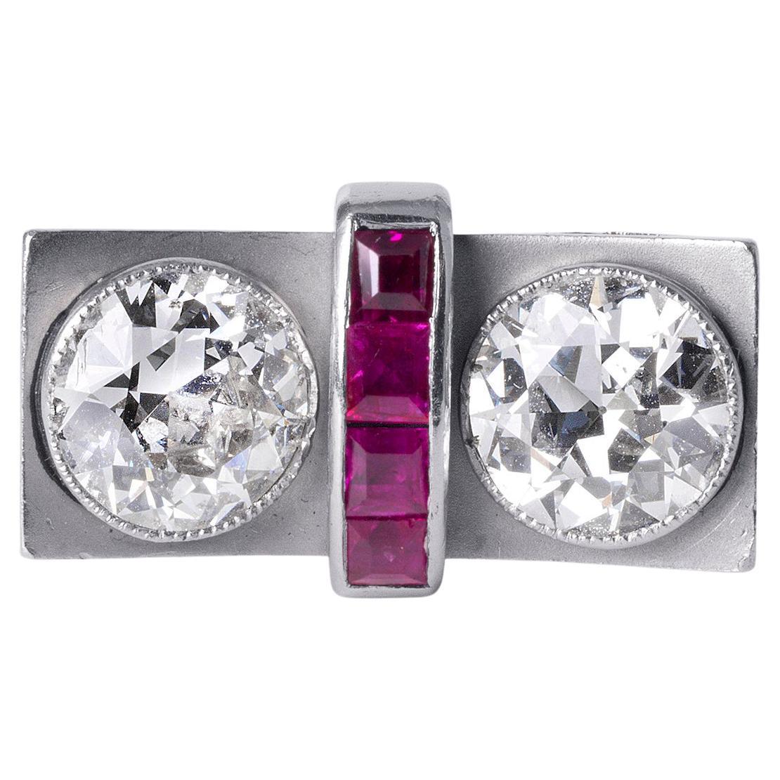 A Rare Treasure: Toi et Moi Retro Diamond & Ruby Ring in Platinum

This one-of-a-kind Toi et Moi ring tells a love story through two remarkable old European cut diamonds. With a combined weight of over 2 carats, these diamonds radiate with timeless