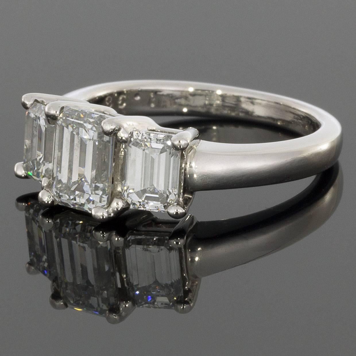 This ring features 3 gorgeous emerald cut diamonds that prong set in a classic platinum 3-stone ring mounting. The diamonds are of excellent quality, grading as completely colorless (D-E) & 100% eye clean (VS1-VS2). The diamonds are also very well