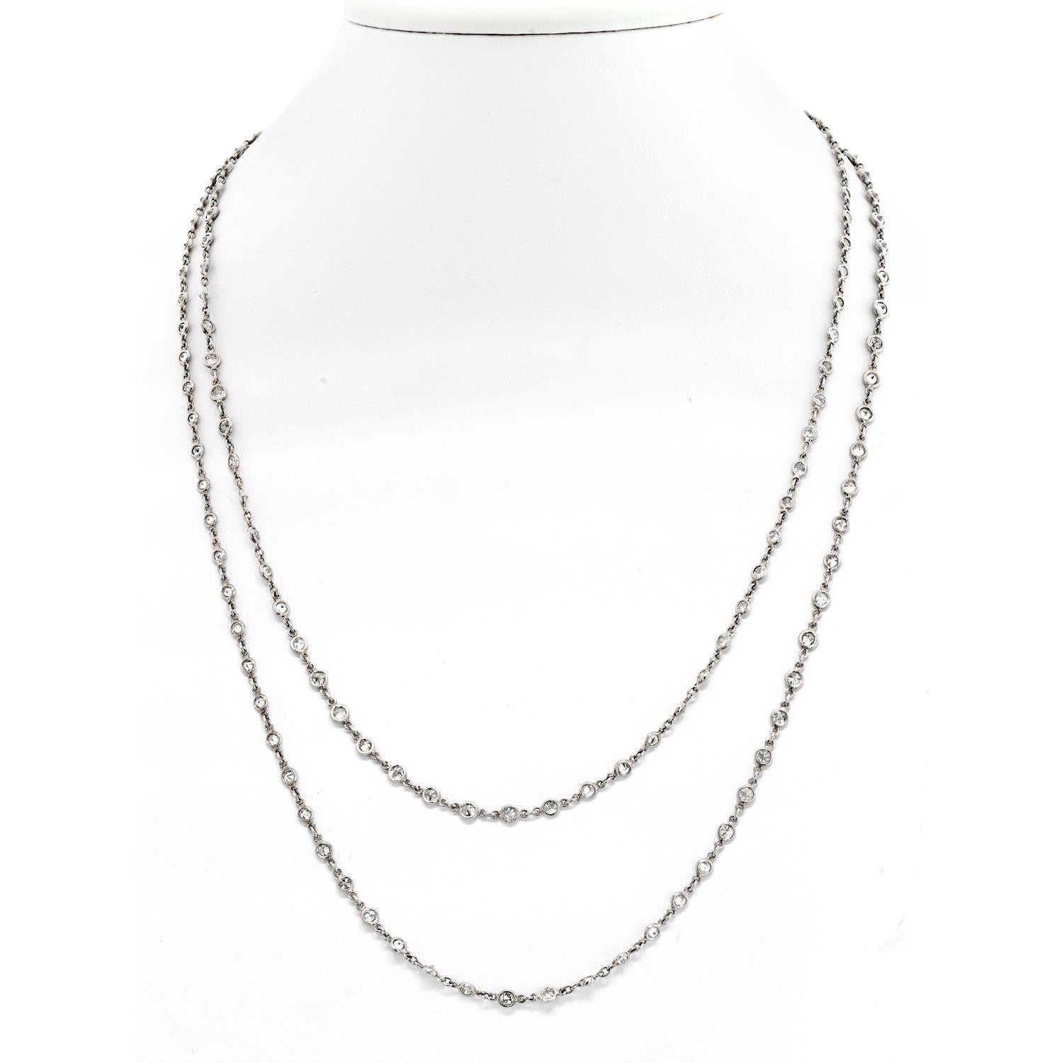 The Platinum 20.00cttw Diamond By The Yard Chain Necklace is a stunning piece of jewelry that exudes elegance and sophistication. This 44-inch long necklace features sparkling diamonds that are all bezel set, giving it a sleek and modern look. The