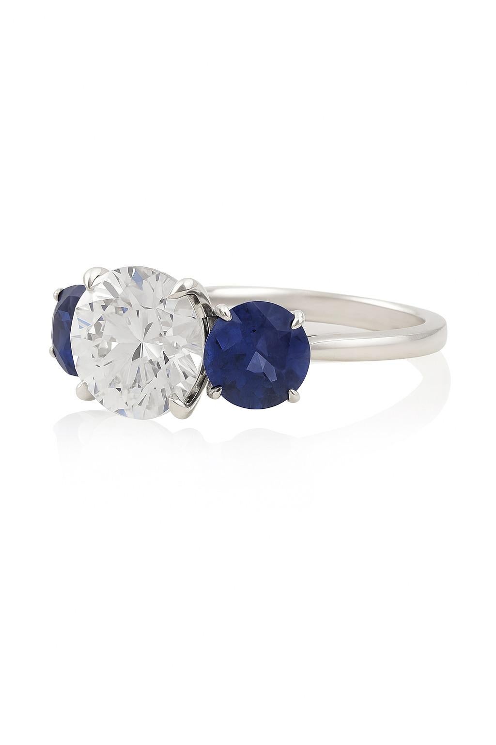 Contemporary Platinum 2.03 Carat Diamond and Sapphire Three-Stone Ring For Sale