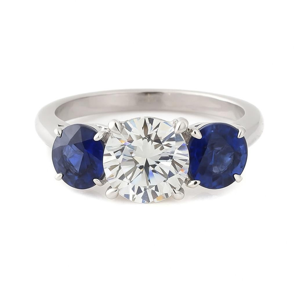Round Cut Platinum 2.03 Carat Diamond and Sapphire Three-Stone Ring For Sale