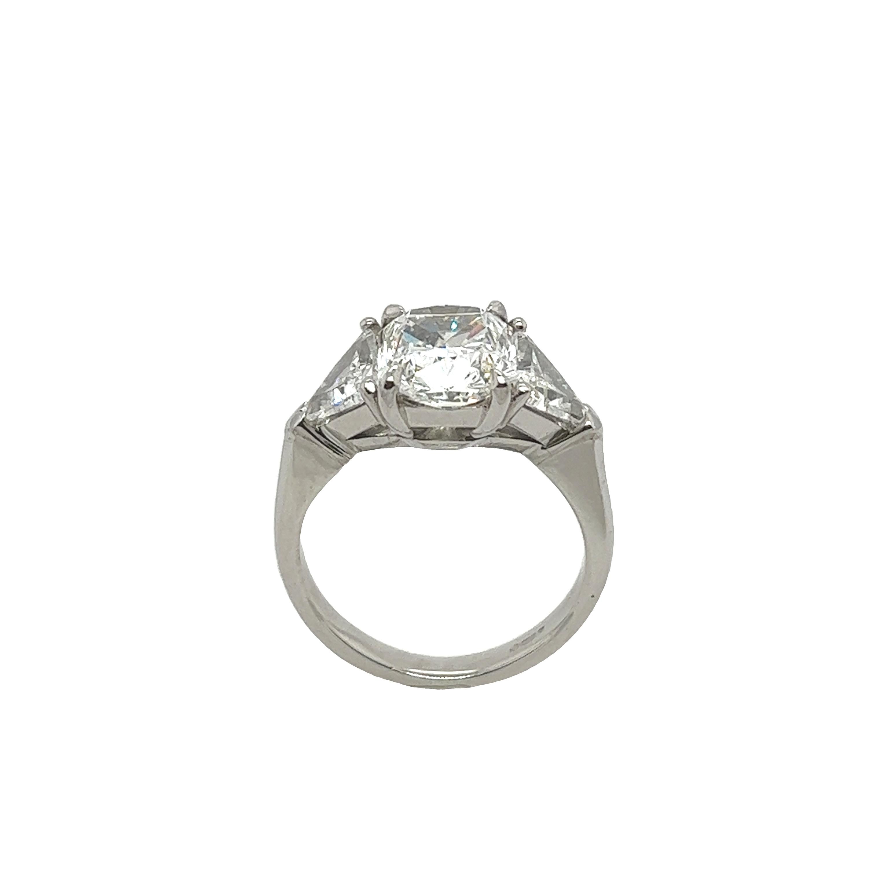 Platinum 2.03ct E colour VVS2 clarity square modified GIA 
natural diamond 3-stone ring set with 2 matching triangle diamonds 1.60ct.
This ring is elegant and beautiful for an engagement ring and will last as long as your love does.
·         Total