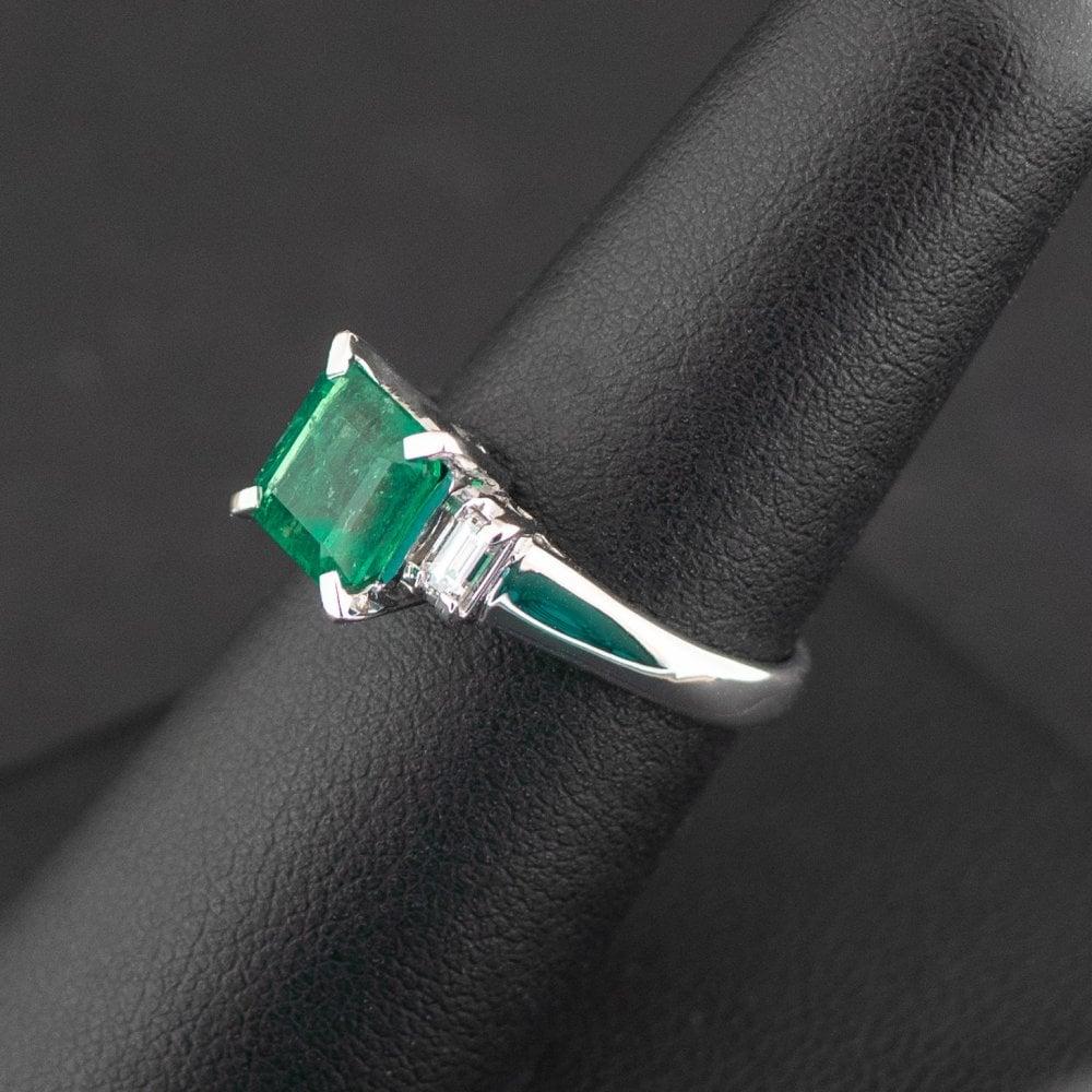 Condition: Pre-Owned
Material: Platinum
Purity: Pt900
Main Stone Identity: Emerald
Main Stone Total Carat Weight: 1.82ct 
Secondary Stone: Diamond
Secondary Stone Total Carat Weight: 0.24pts
Ring Size: UK N
Certificate: Japanese Gem Report Included
