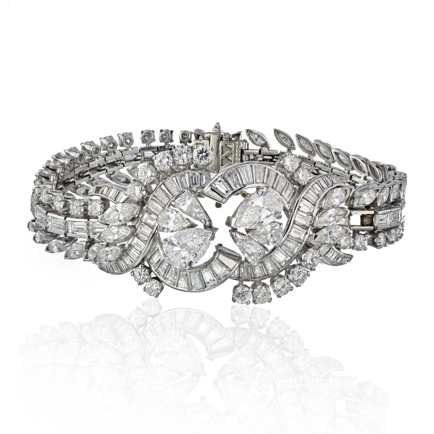 Step into the glamour of the 1970s with this exquisite estate diamond bracelet, a true testament to timeless elegance. 

Meticulously crafted in platinum, this bracelet boasts a captivating array of diamonds, including pear-cut, marquise-cut, and