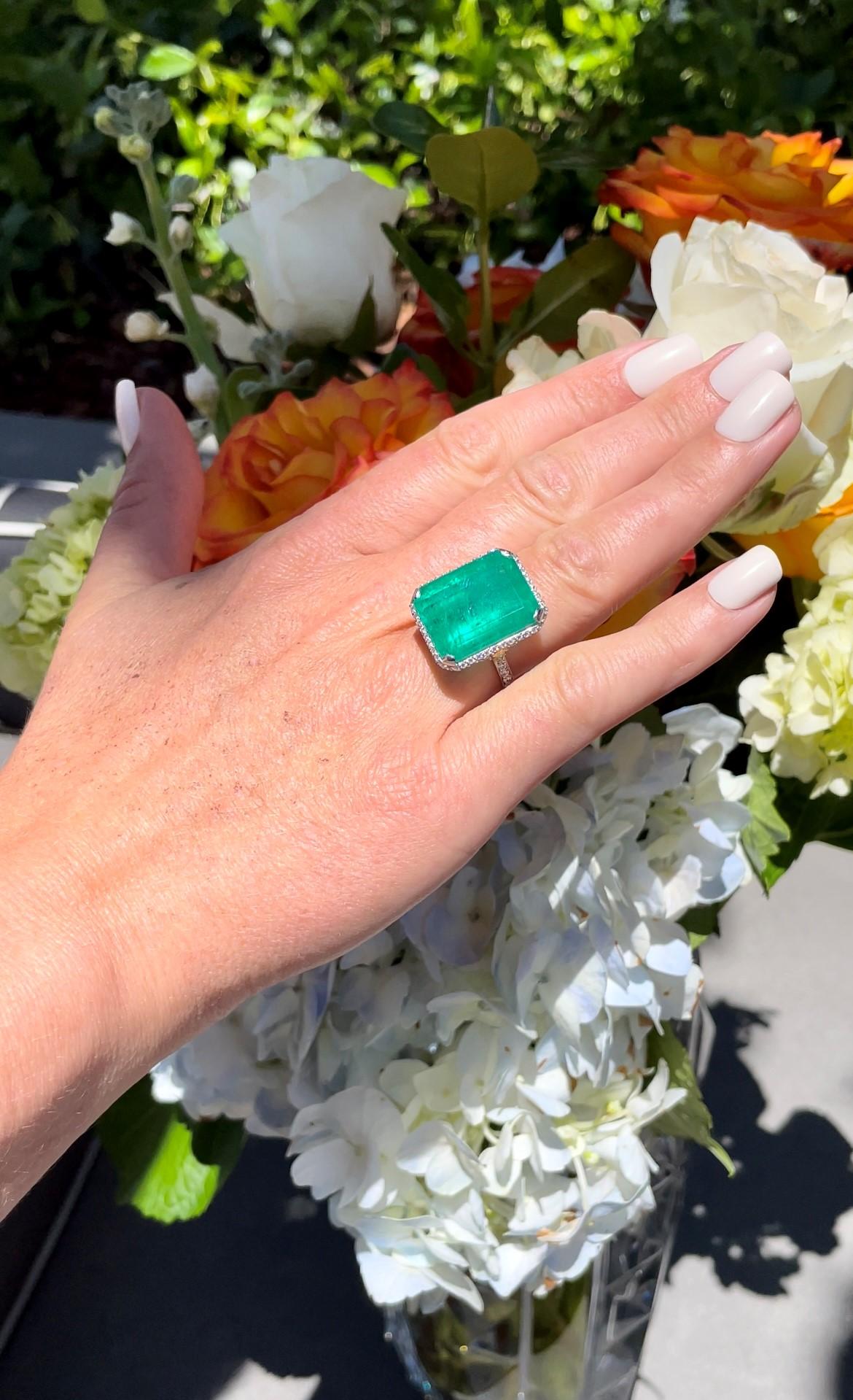 This astounding ring is crafted of platinum with a extraordinary 21.49 carat emerald cut emerald. It is surrounded by diamonds weighing a total weight of 0.83 carats.