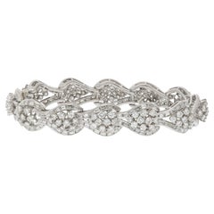 Bracciale in platino con diamanti rotondi e baguette da 22 carati