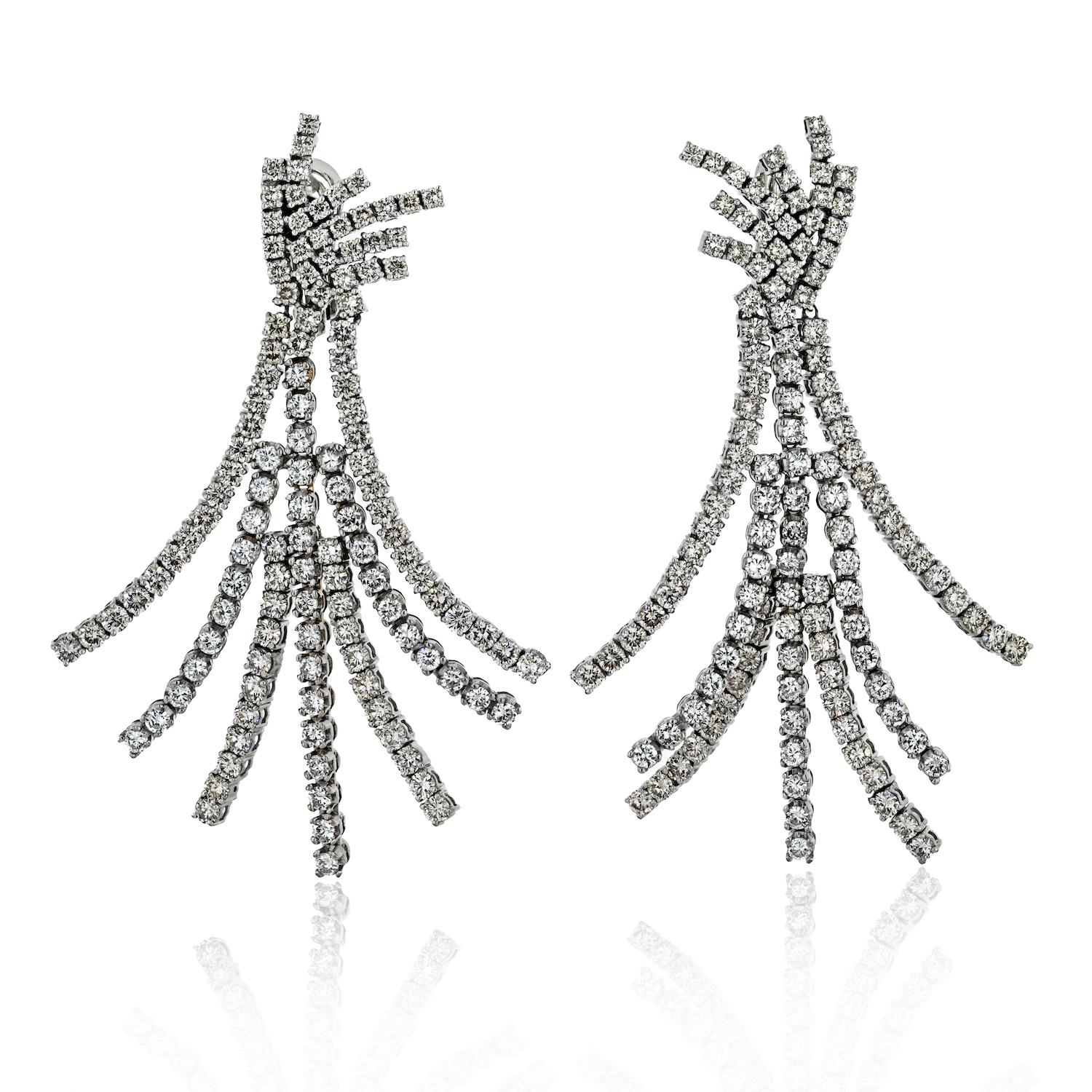 Embodying the epitome of luxury, the Platinum 22.00cttw Pendant Diamond 7 Row Tassel Earrings are a testament to the mastery of fine jewelry craftsmanship, offering a breathtaking fusion of design, precision, and sheer magnificence. Adorn yourself