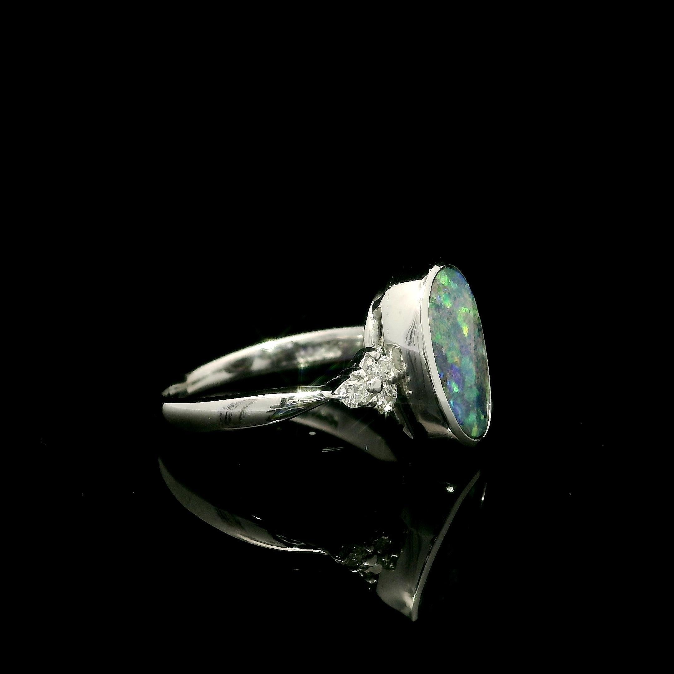 Platinum 2.29ctw Oval Bezel Boulder Opal w/ Diamond Cluster Accents Modern Ring In Excellent Condition For Sale In Montclair, NJ